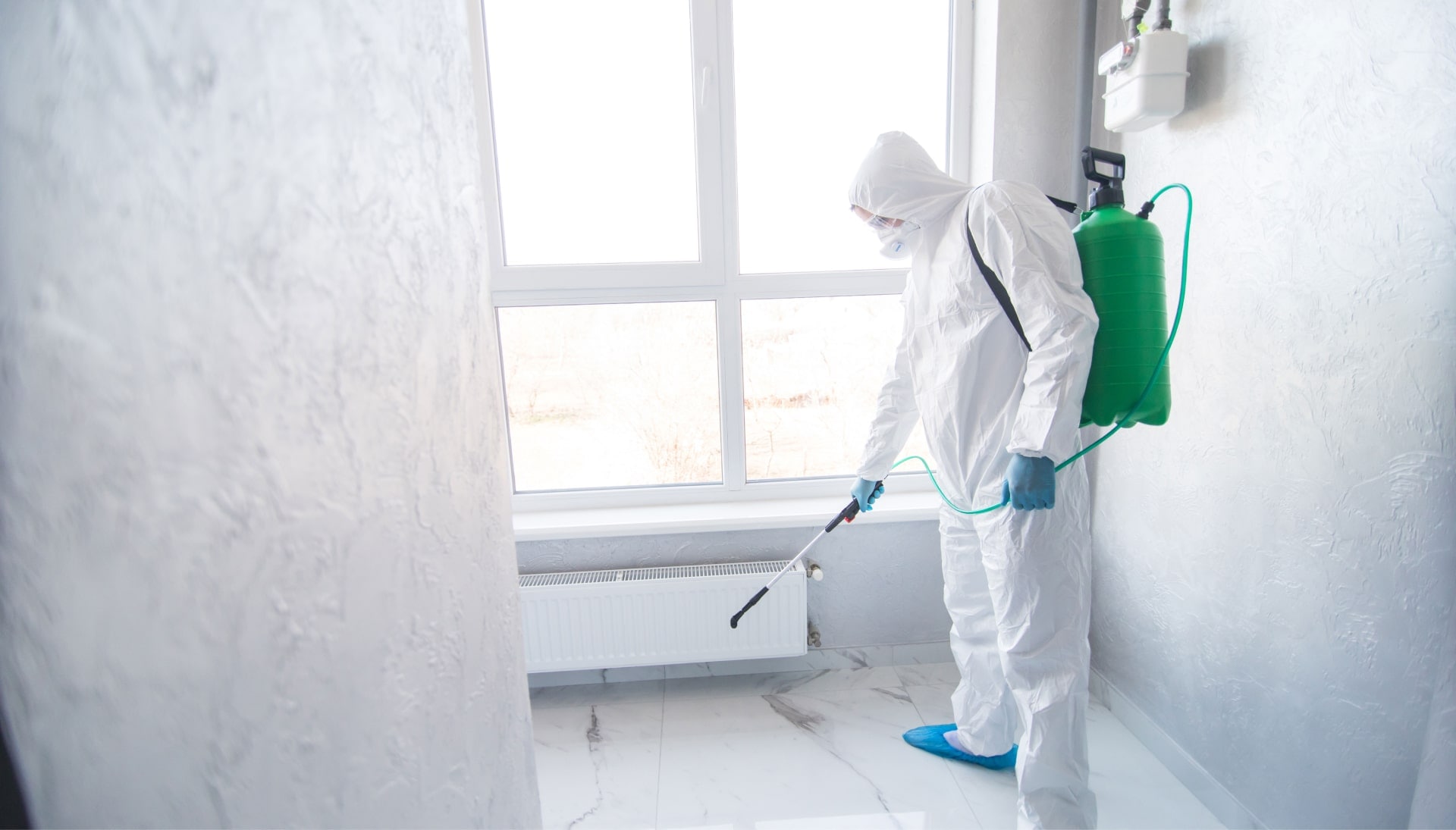 A certified mold inspector using specialized equipment to identify and locate mold growth in a residential property in Miami